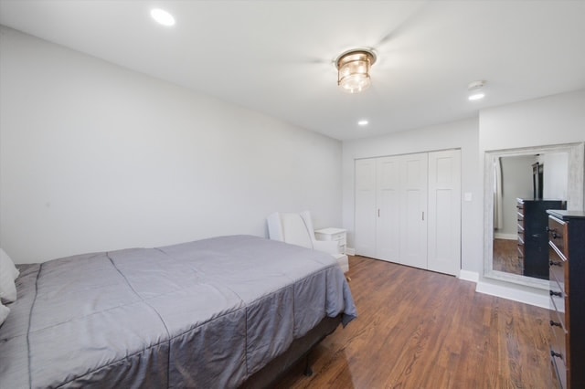Bedroom with gray bed and double closet