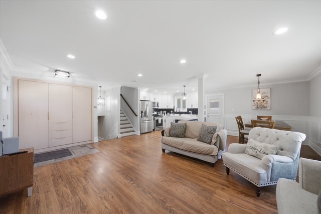 Wide angle living room with staircase and dining area